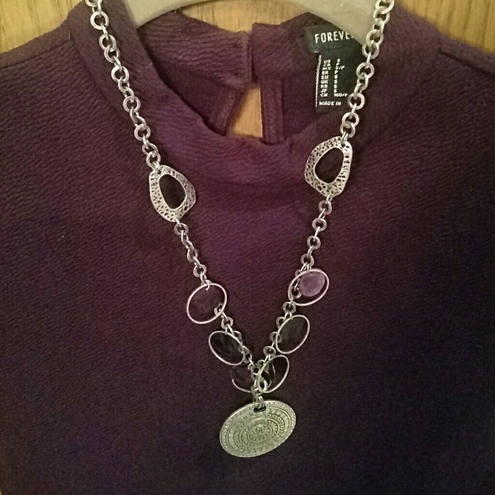 Necklace with metal medallion